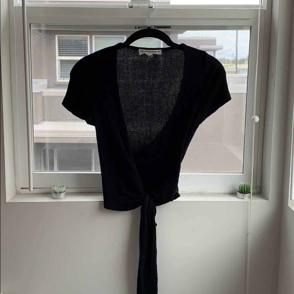 black low v shirt with tie at bottom